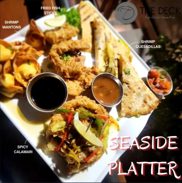 Seaside Platter — shrimp wontons, fried fish sticks, shrimp quesadillas and spicy calamari with dipping sauces